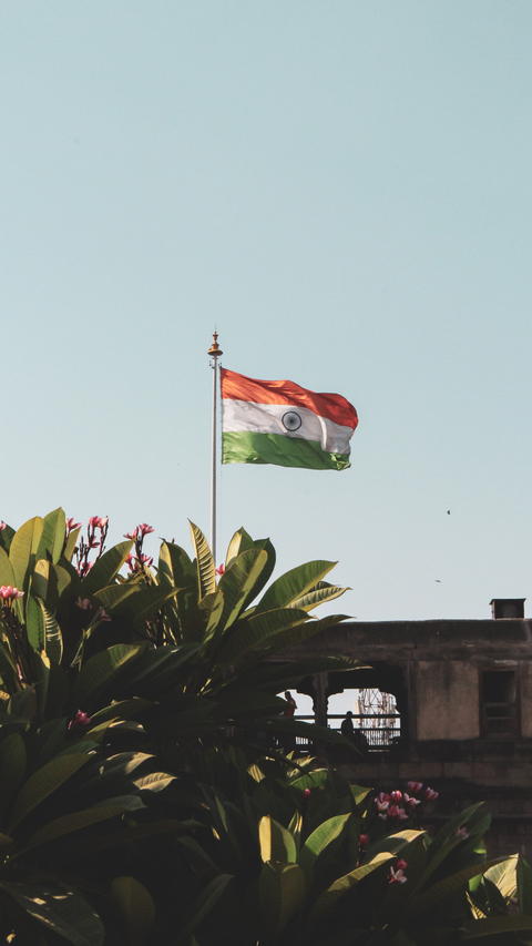 Free photo of A flagpole with a Indian Flag on top of it