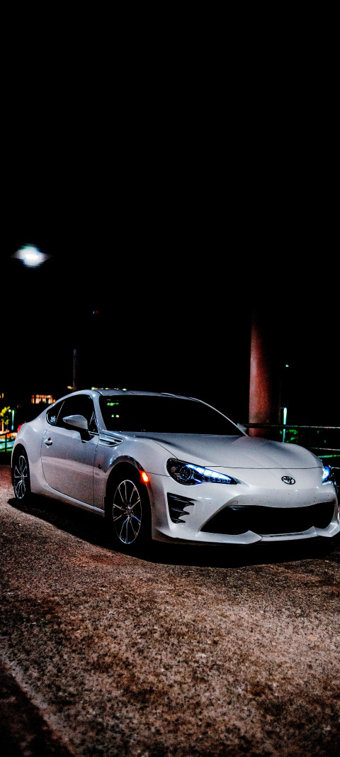Toyota 86 GT car parked on a street at night