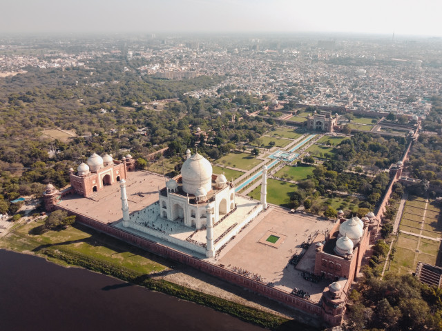 An aerial view of the Taj Mahal, a white marble mausoleum located in Agra, India. It was built in 1632 by Mughal emperor Shah Jahan as a memorial for his wife Mumtaz Mahal.