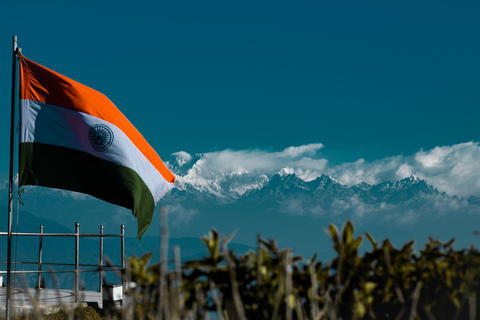 Free photo of Indian Flag at high altitude in front of mountain range