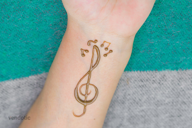 Free photo of Minimal Henna Musical Note Wrist Design