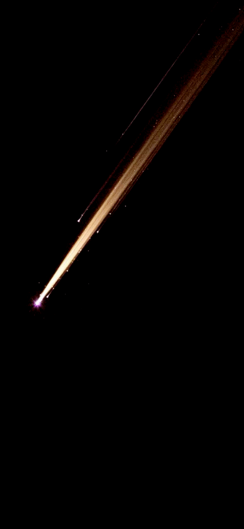 jet streak in the dark sky with a bright light