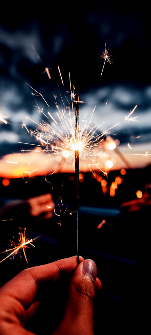 Free photo of Misc  Amoled Wallpaper with Sparkler, Hand & Sky