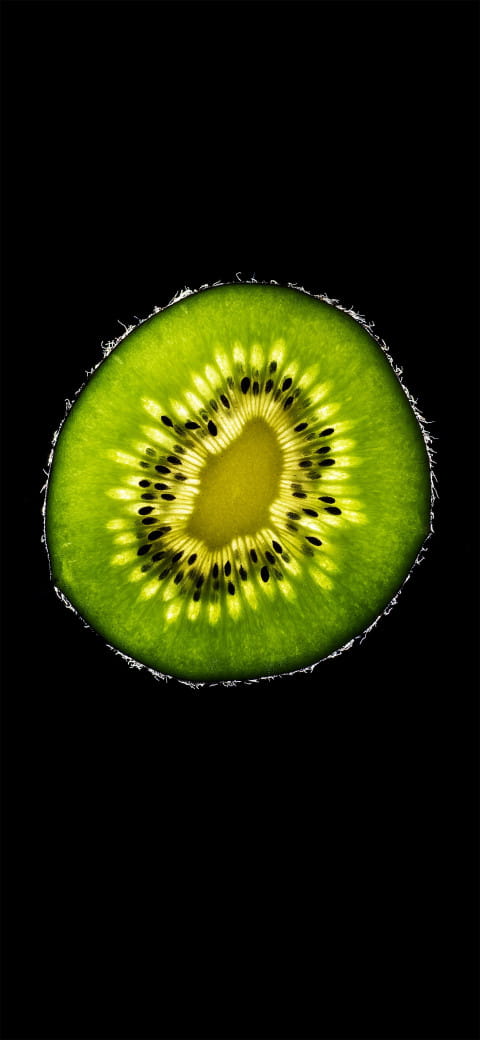 close up of a kiwi fruit cut in half