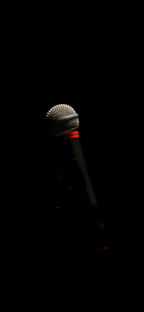 microphone in the dark with a light shining on it