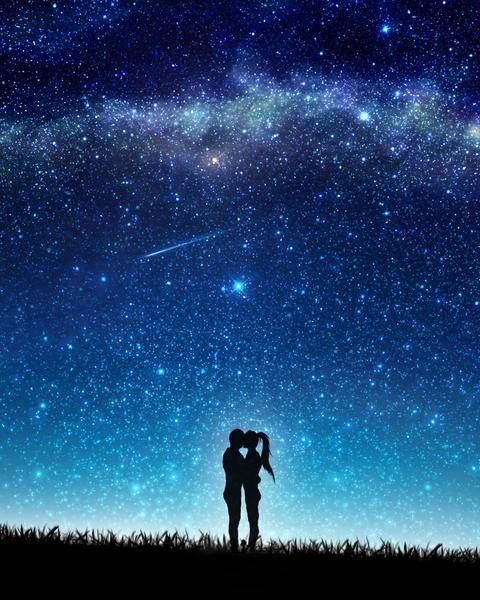 Free photo of starry night sky with silhouette of two people standing on grass