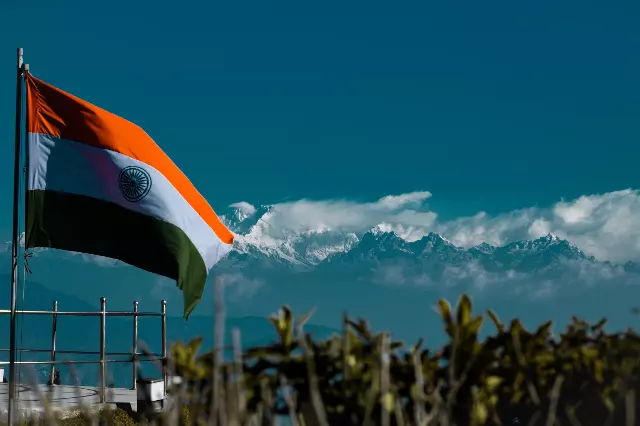 Indian Flag at high altitude in front of mountain range