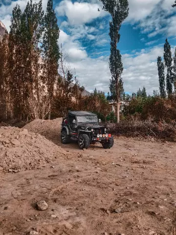 mahindra thar parked in the dirt