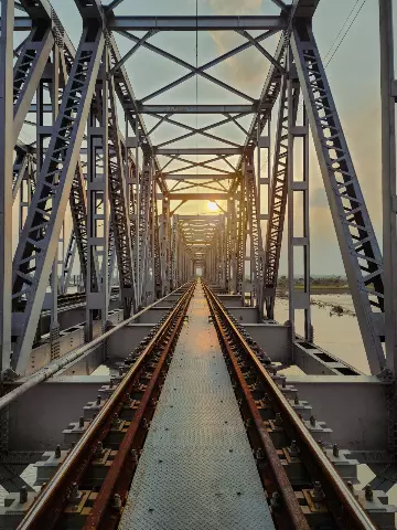 view of a train track inside a bridge